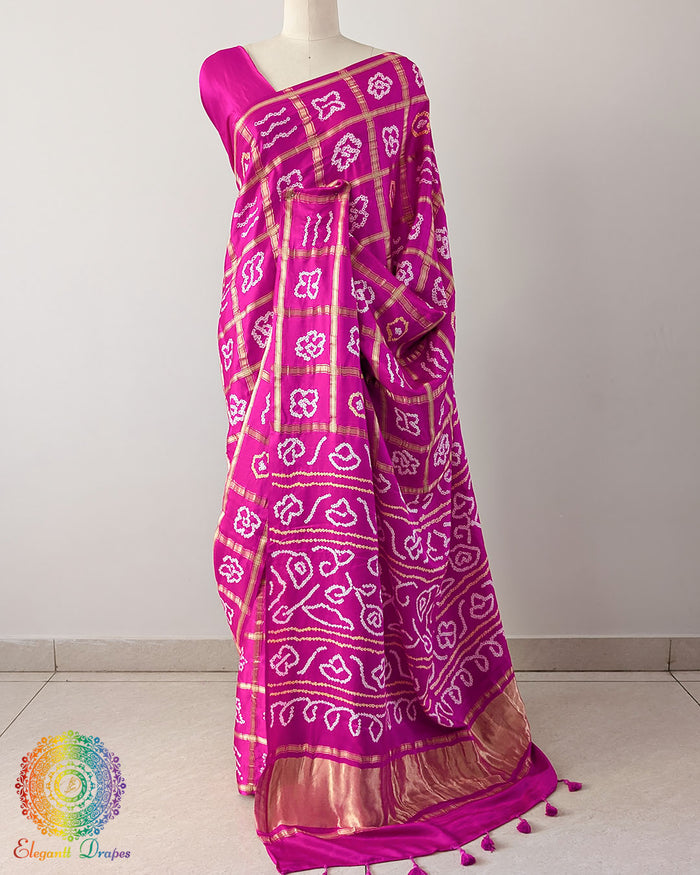Pink Gharchola Pure Gajji Silk Bandhani Saree with the palla visible in a draped view, displaying the traditional Gharchola pattern and intricate Bandhani detailing.