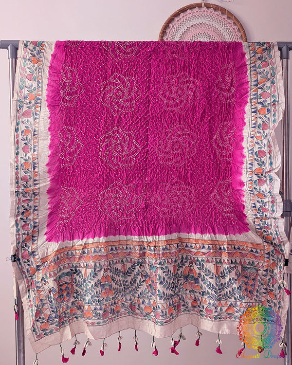 Rani Pink Muga Silk Dupatta with Bandhani body and hand-painted Madhubani artwork border
