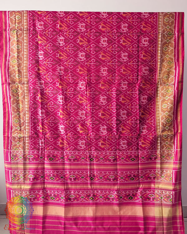 Rani Pink Handwoven Mulberry Silk Rajkot Patola Saree – Full Saree View displaying the complete saree with its striking Rani Pink shade, intricate Patola patterns and natural silk sheen, reflecting the artistry of traditional Gujarati weaving.