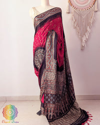 Red bandhani gaji silk saree with Ajrakh palla on mannequin showing full drape