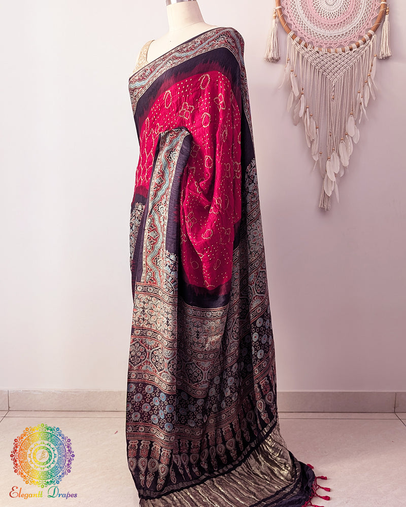 Side angle view of red Ajrakh palla saree on mannequin highlighting drape