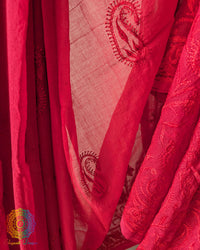 Close up of Chikankari-inspired paisley embroidery on red Bengal cotton saree