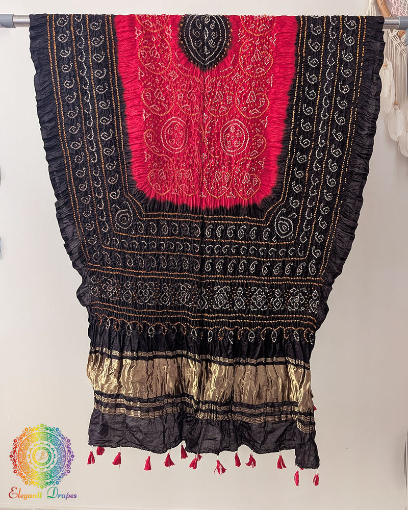 Close up of black red bandhani gaji silk dupatta showing tie dye detail