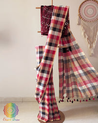 Red and black Madras checks Bengal cotton saree laid open displaying Jamdani palla and overall design