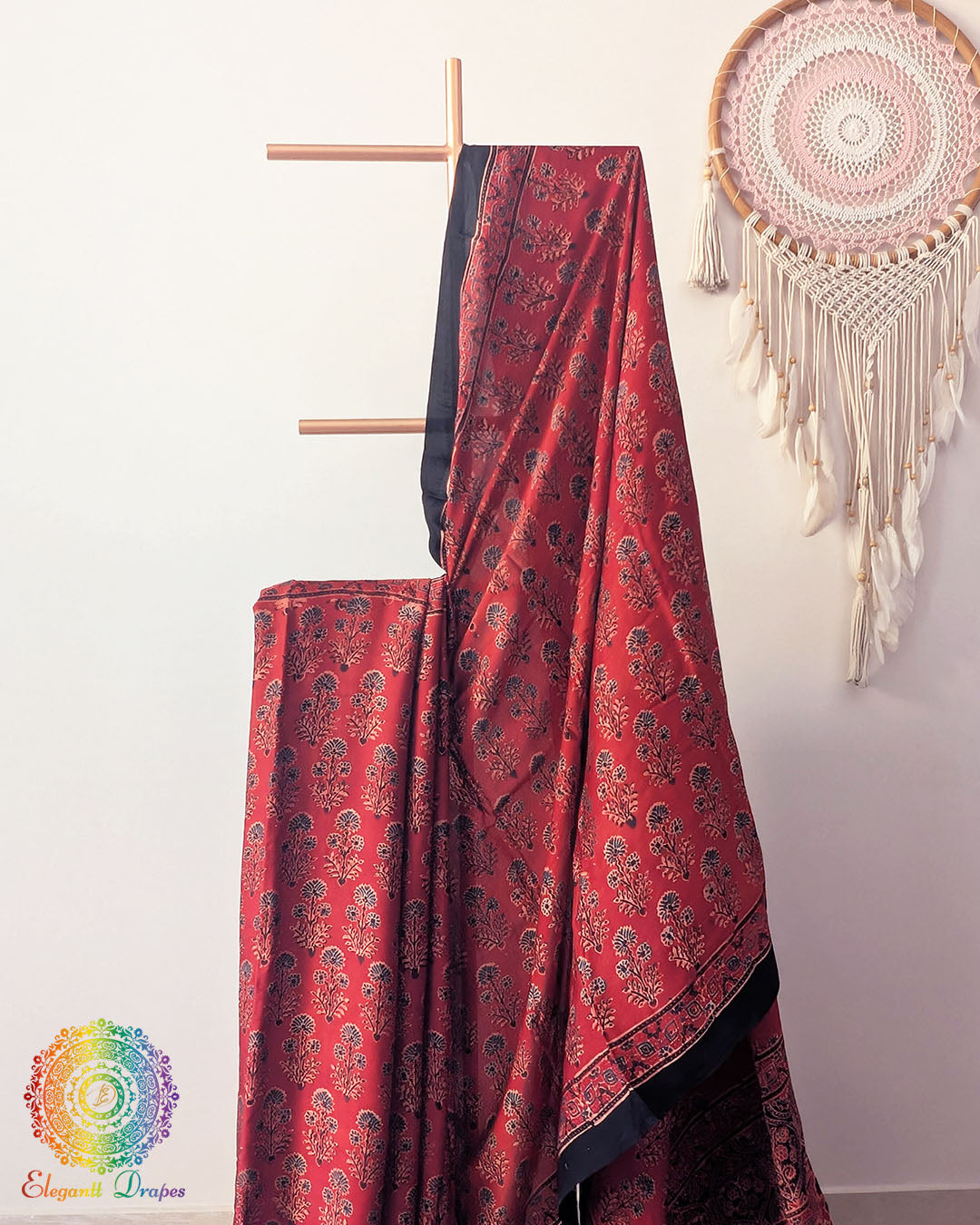 Close up of red modal silk Ajrakh block print saree