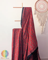 Close up of red modal silk Ajrakh block print saree