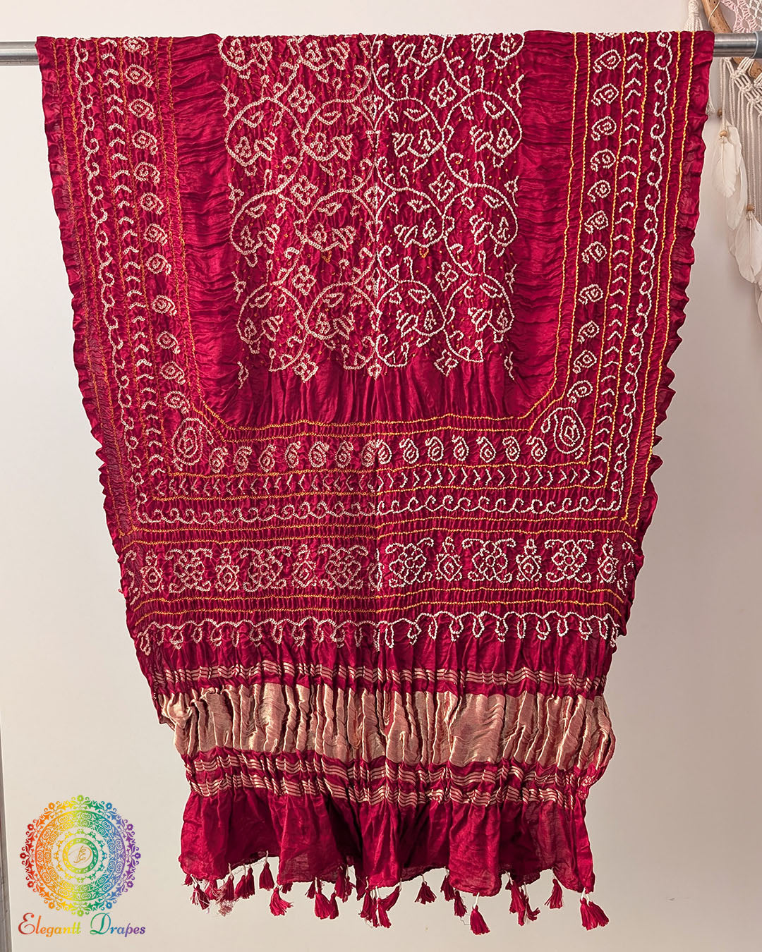 Close up of red bandhani gaji silk dupatta showing tie dye detail