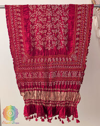 Close up of red bandhani gaji silk dupatta showing tie dye detail