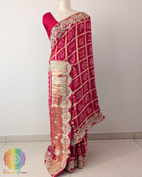 Red Gaji Silk Gharchola Saree with the palla visible in a draped view, displaying the traditional Gharchola design and decorative golden Gota Patti work.