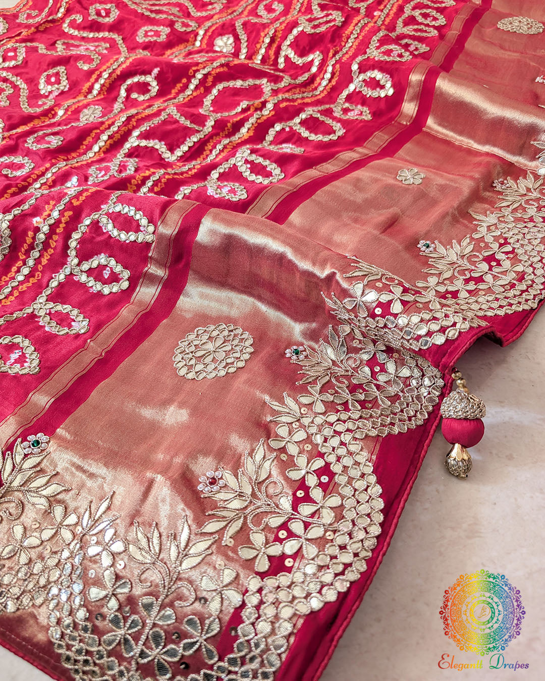 pallu of the Red Gaji Silk Gharchola Saree, showcasing the intricate Gota Patti handwork, traditional patterns and rich Gaji Silk texture.