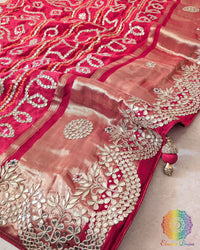 pallu of the Red Gaji Silk Gharchola Saree, showcasing the intricate Gota Patti handwork, traditional patterns and rich Gaji Silk texture.