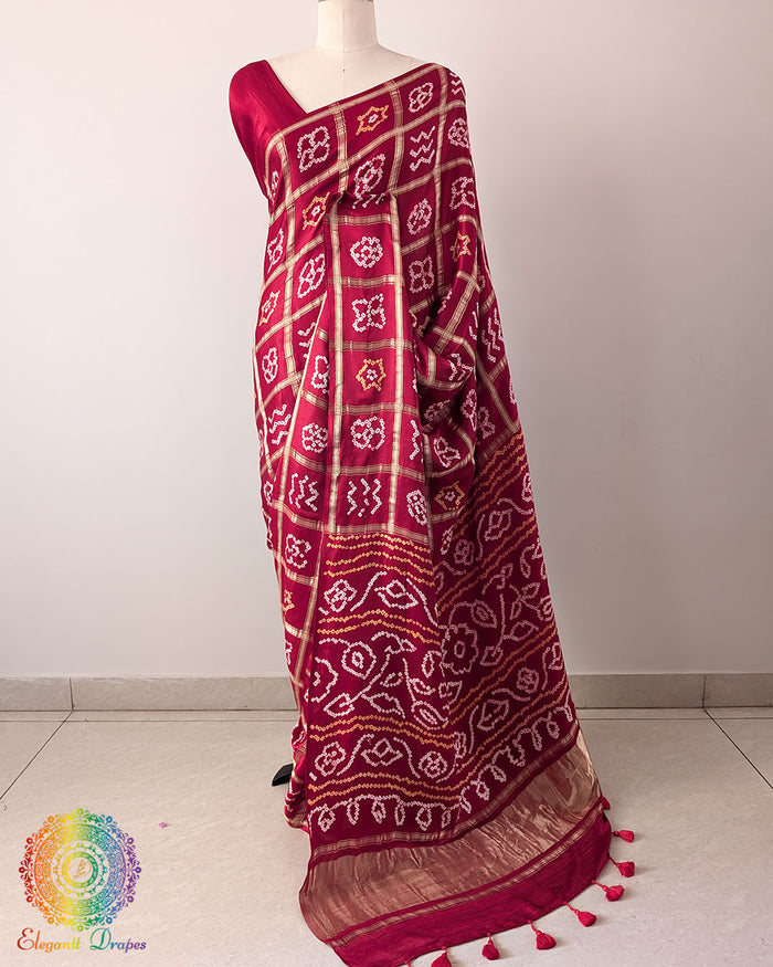 Red Gharchola Pure Gajji Silk Bandhani Saree with the palla visible in a draped view, displaying the traditional Gharchola pattern and intricate Bandhani detailing.