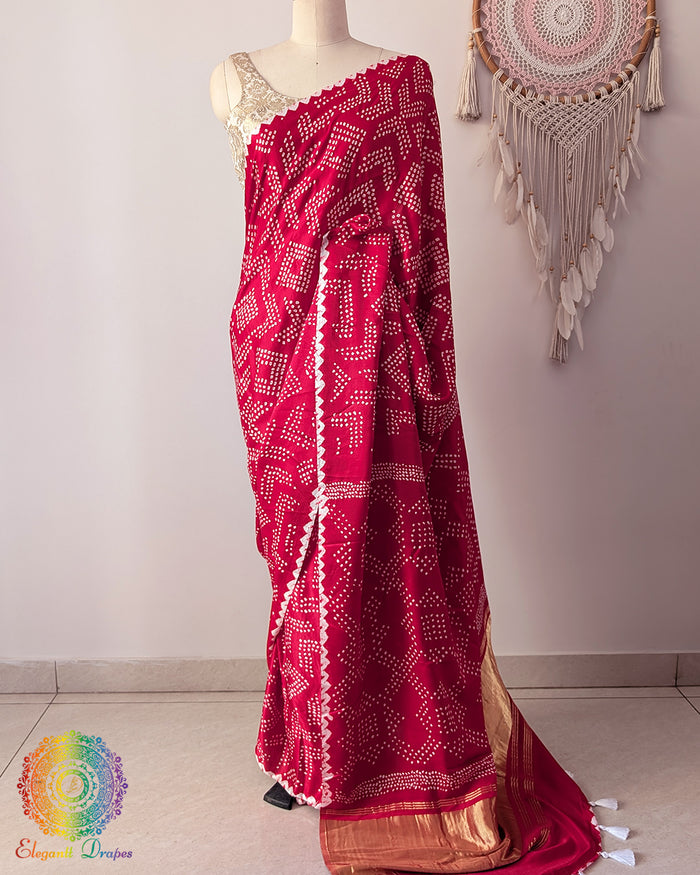 Red gaji silk bareek bandhej saree on mannequin showing full drape and silhouette