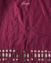 Sleeve detail of the Deep Red Kala Cotton Kutch Mirror Handwork blouse piece, highlighting the real mirror embellishments, detailed threadwork and rich deep red cotton fabric.