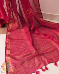 Sequin detail close up on red linen saree highlighting subtle shimmer