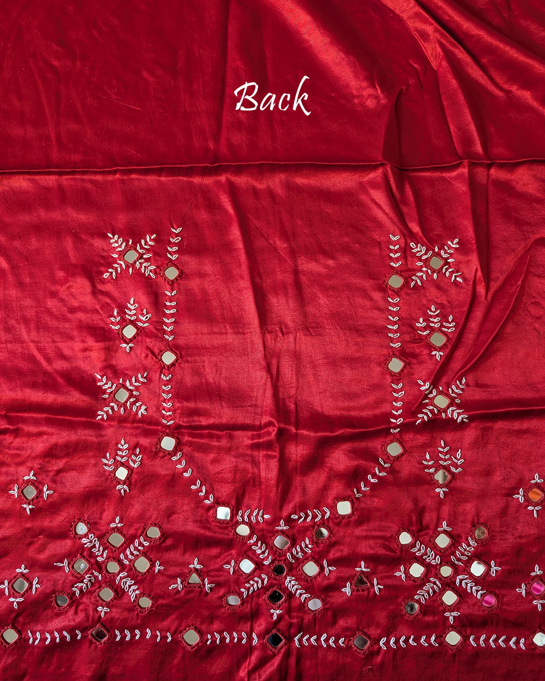 Close-up of Kutch mirror work on the back of Red Mashru Silk Blouse Piece