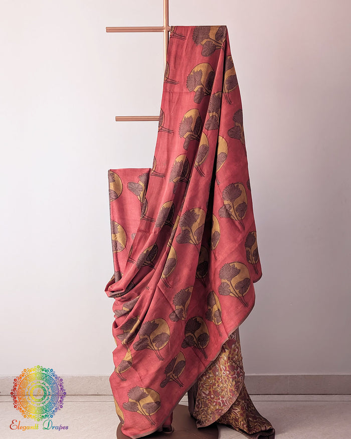 Red Nashpal Pomegranate Ajrakh Modal Tussar Silk Saree with the palla fully opened, showcasing the rich red shade and traditional floral Ajrakh design.