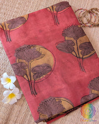 Red Nashpal Pomegranate Ajrakh Modal Tussar Silk Saree folded to display its vibrant red colour and intricate Nashpal Pomegranate Ajrakh floral print.