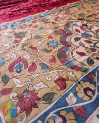 Close-up of the traditional Bandhani-dyed body on the Red Muga Silk Saree