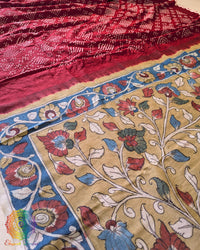 Close-up highlighting the natural sheen and luxurious texture of the Red Bandhani Kalamkari Muga Silk Saree