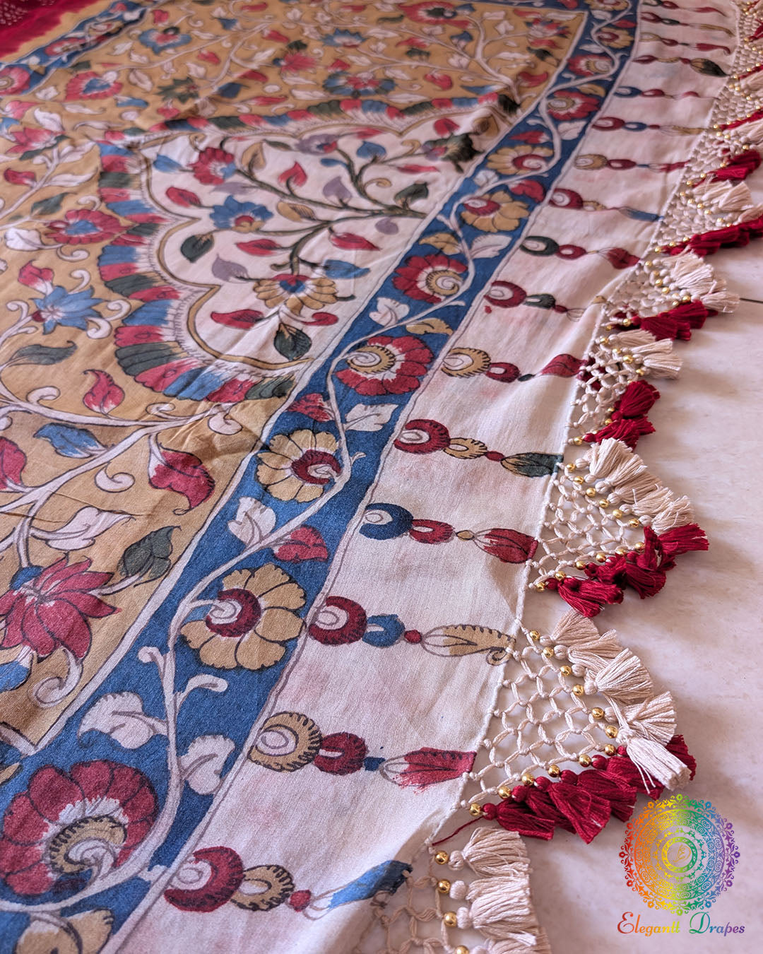 Close-up of the Kalamkari pallu with heavy tassels on the Red Bandhani Kalamkari Muga Silk Saree