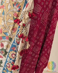 Close-up of the intricate Kalamkari artwork on the pallu of the Red Bandhani Muga Silk Saree