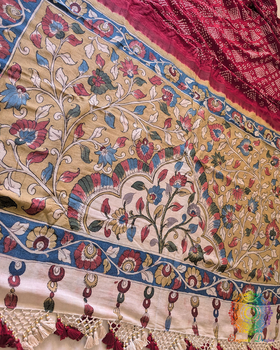Detailed view showcasing the combination of Bandhani craftsmanship and Kalamkari artistry on the Red Muga Silk Saree