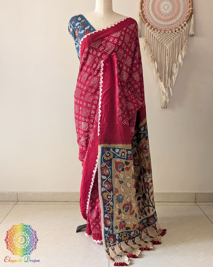 Red Bandhani Kalamkari Muga Silk Saree showcased on a mannequin highlighting its elegant drape and traditional craftsmanship
