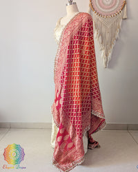 Dual tone red orange bandhani dupatta with delicate edge
