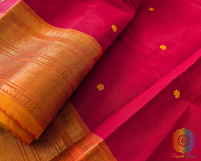 Orange border close up on red Kanchi cotton saree highlighting weave detail