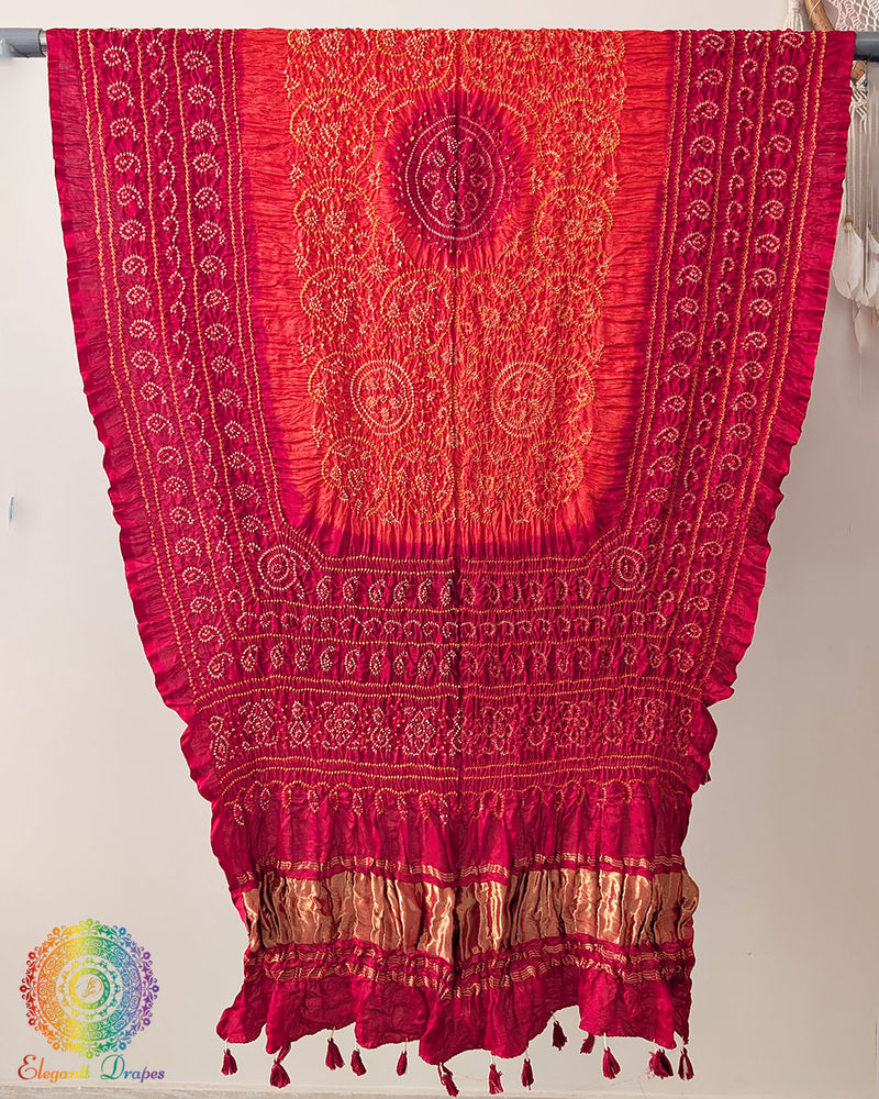 Close up of red orange bandhani gaji silk dupatta showing tie dye detail