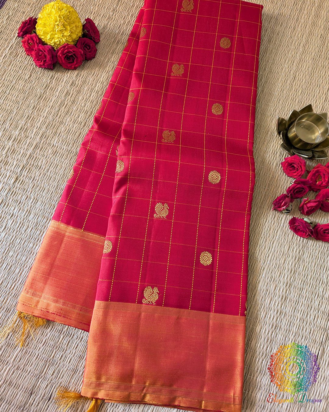 Red Checkered Pure Kanjivaram Handloom Silk Saree with 1gm Gold Zari – Folded View showcasing the rich red silk, traditional checkered weave and elegant gold zari detailing.