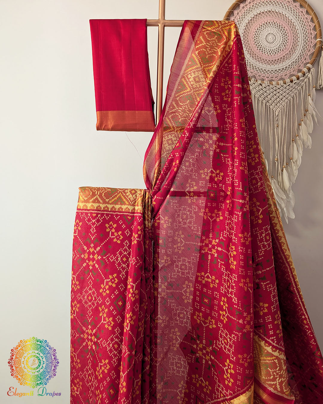 Close up of traditional Rajkot Patola weaving on red pure mulberry silk saree