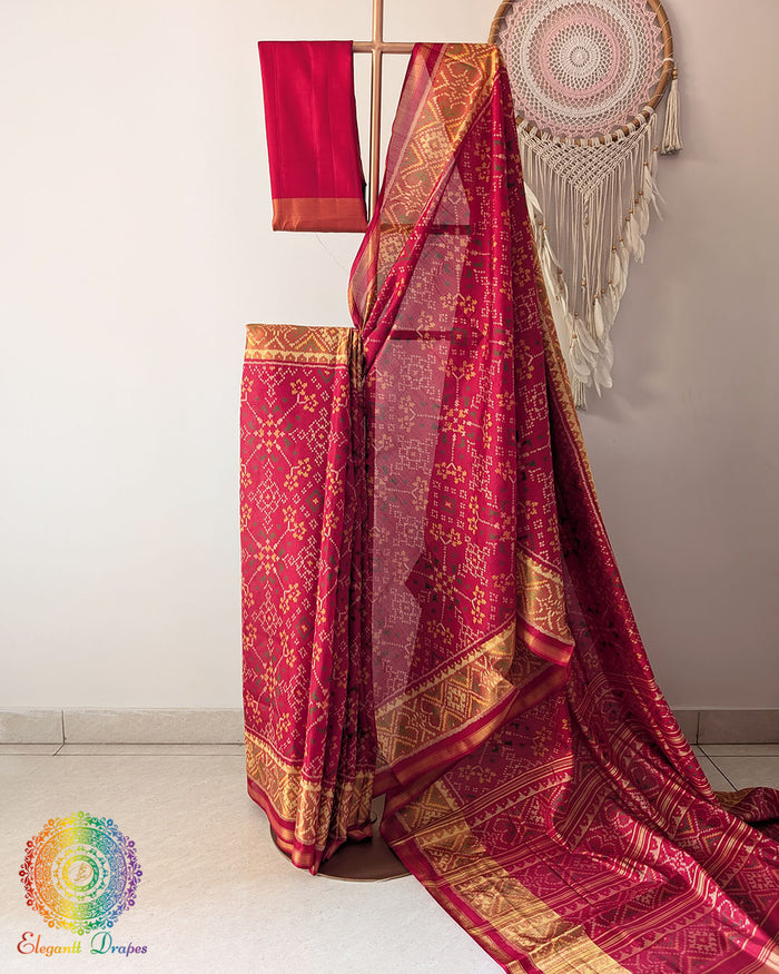 Traditional red Rajkot Patola pure mulberry silk saree on mannequin showing full drape