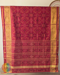 Open palla view of red Rajkot Patola pure mulberry silk saree displaying traditional design
