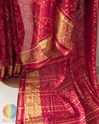 Red Rajkot Patola saree palla close up highlighting intricate woven motifs