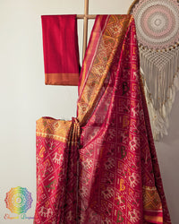 Close up of traditional Rajkot Patola weaving on festive red pure mulberry silk saree