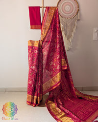 Festive red handwoven mulberry silk Rajkot Patola saree on mannequin showing full drape