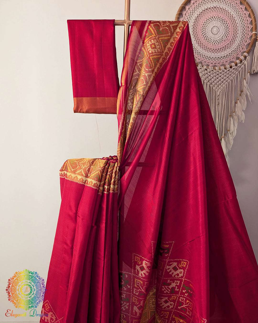 Traditional woven border detail on red mulberry silk Patola saree