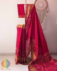 Red mulberry silk Patola saree on mannequin showcasing woven motifs
