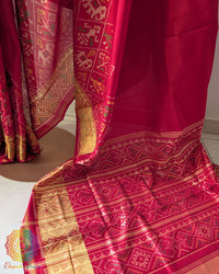 Palla close up on red handwoven Rajkot Patola saree highlighting intricate weaving