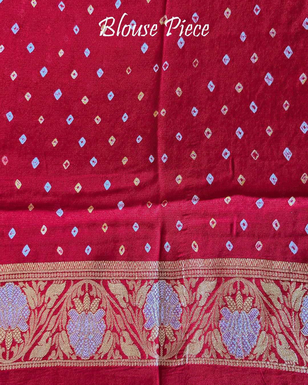 Matching blouse piece in red pink Banarasi khaddi georgette fabric showing weave detail