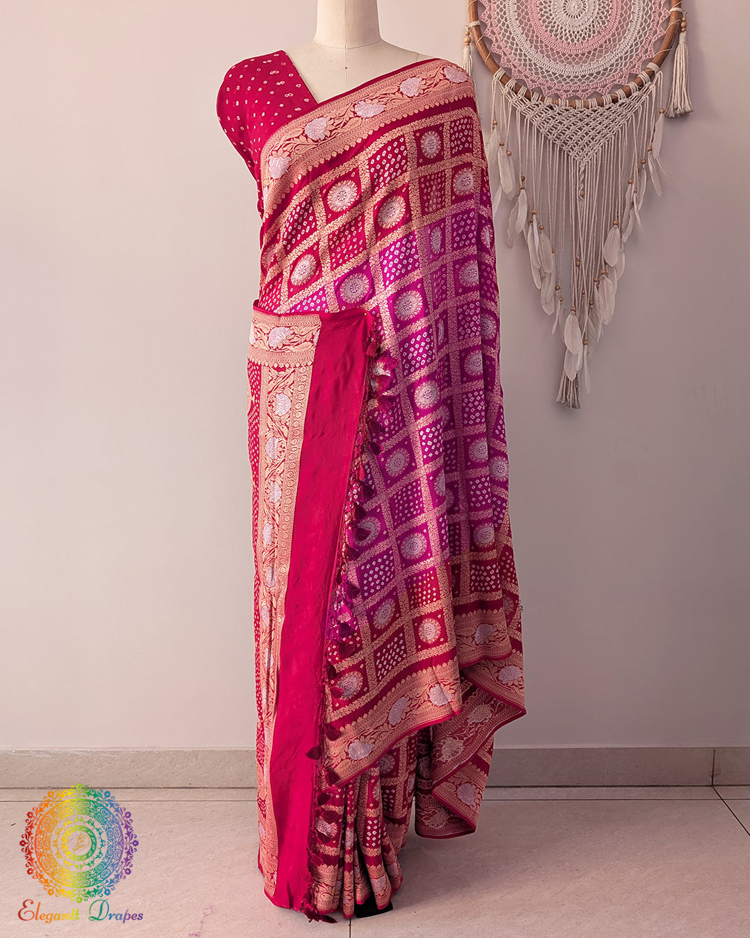 Red pink georgette saree on mannequin showcasing Gharchola pattern and zari weave