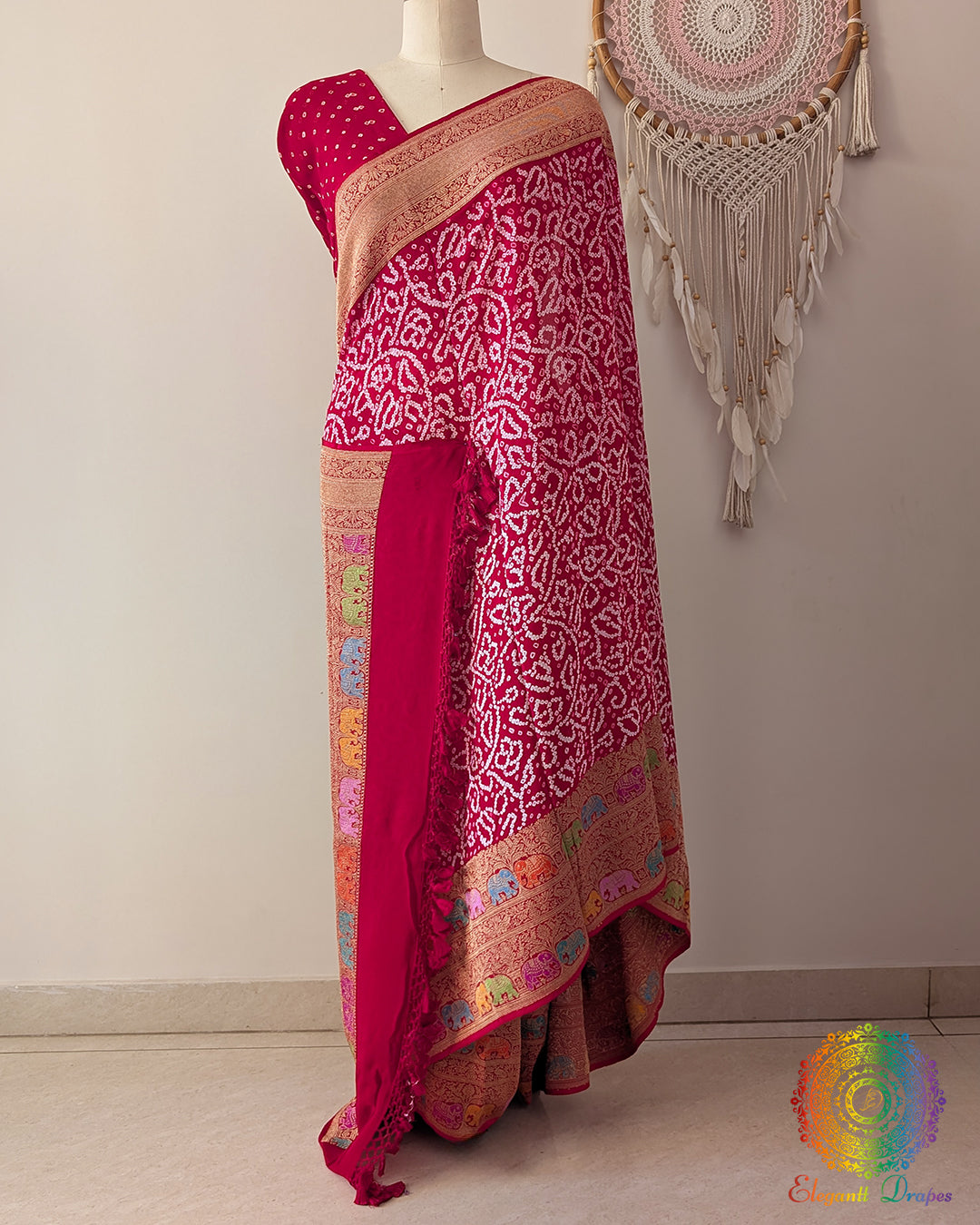 Red Banarasi saree on mannequin showcasing Shikargah pattern and meenakari weave