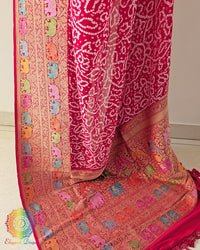 Palla close up on red georgette saree highlighting meenakari bandhani detailing