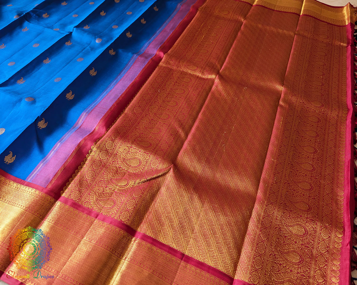 Red palla close up showcasing intricate 2 gram zari weaving on Kanjivaram silk saree