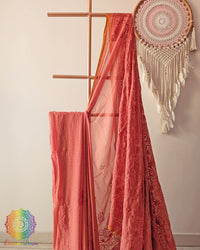 Rust brown Bengal cotton saree fabric close up highlighting soft weave and embroidery-inspired detailing