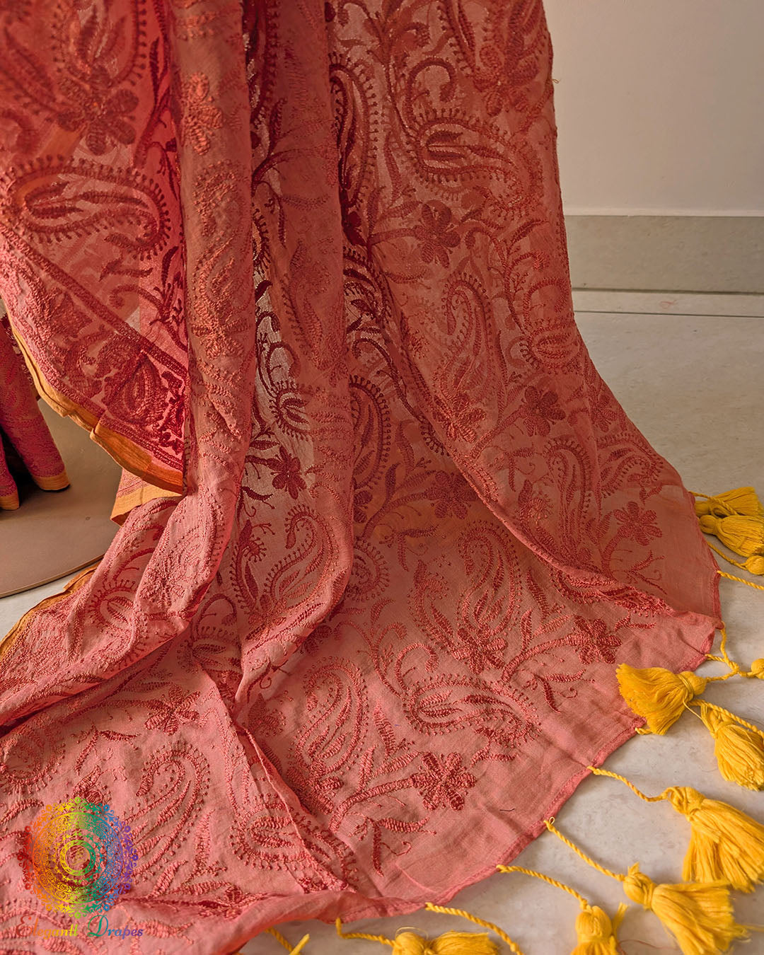 Rust brown cotton saree showcasing intricate paisley threadwork motifs