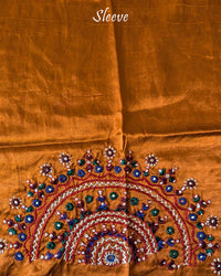 Close-up of semi-circular Bavadiya handwork on Rust Orange Mashru Silk Blouse Piece sleeve