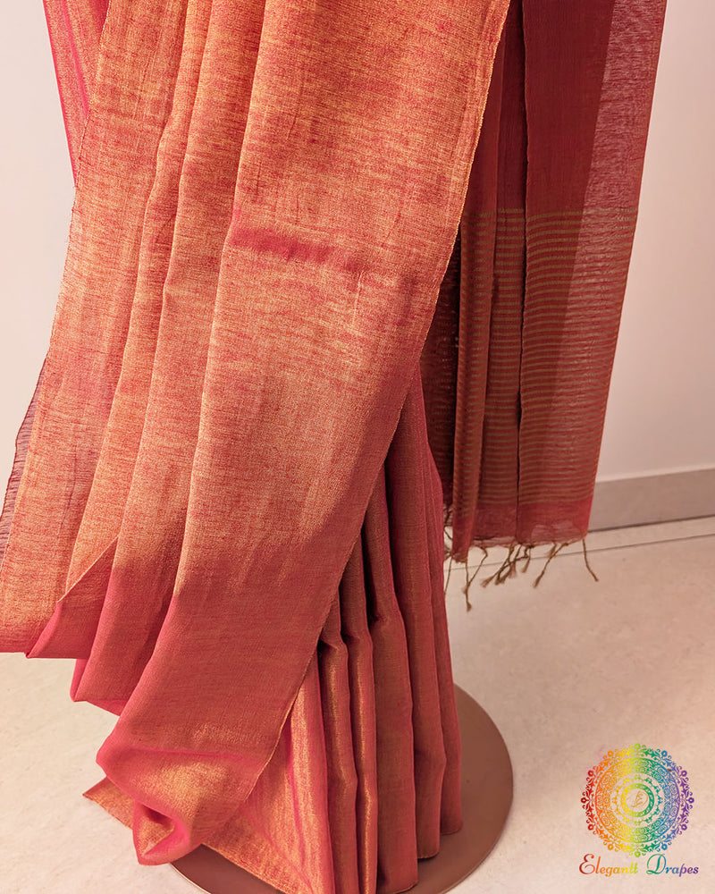 Palla close up on orange Bengal linen tissue saree highlighting woven texture